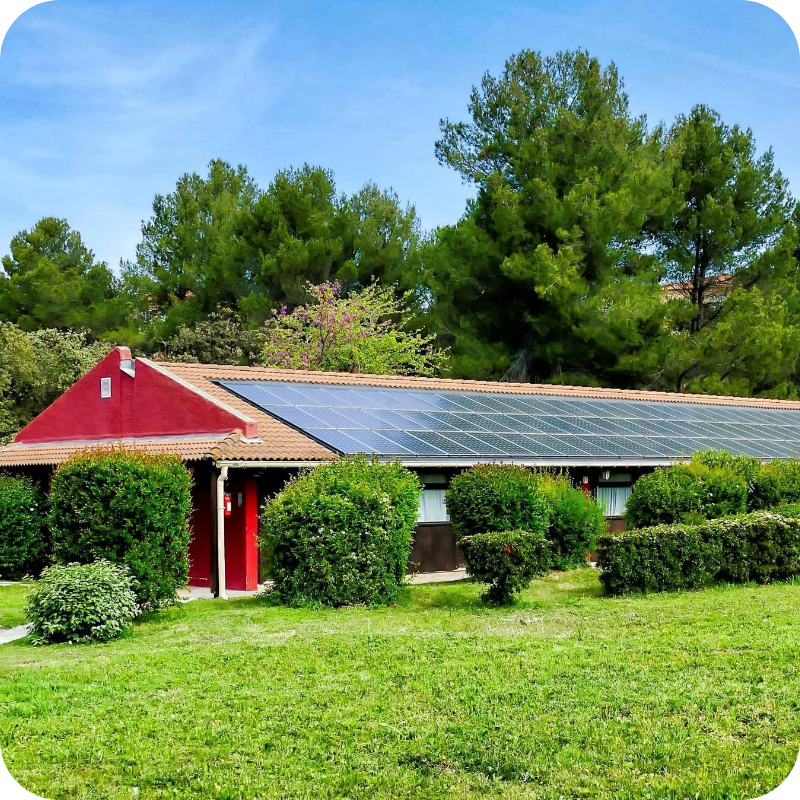 vertical-shot-small-house-with-solar-panels-green-field-canary-islands